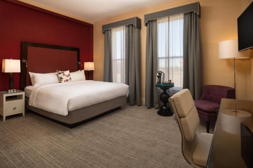 a hotel room with a bed and a chair at Hotel Shattuck Plaza in Berkeley