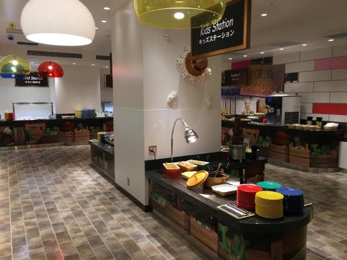a restaurant with a counter with food on it at LEGOLAND Japan Hotel in Nagoya