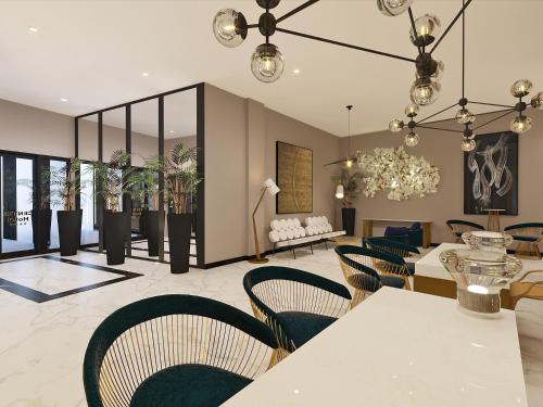 a living room with chairs and a dining room at Le Centell Hotel & Spa in Antananarivo