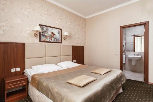 Lova arba lovos apgyvendinimo įstaigoje Hotel Sokol