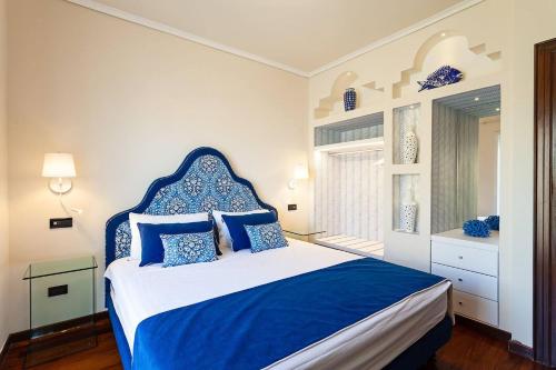 Ένα ή περισσότερα κρεβάτια σε δωμάτιο στο Villa Orlando