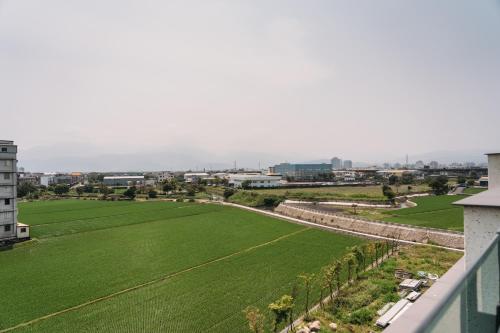 a view of a green field from a building at Tsang Kuo Resort in Wujie