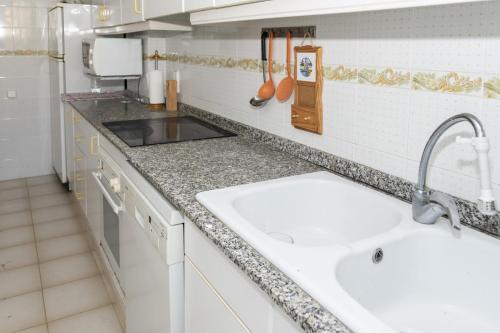 a kitchen with a sink and a counter top at Nueva Vista 2º-4 in Cullera