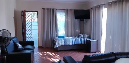 Ένα ή περισσότερα κρεβάτια σε δωμάτιο στο Getaway Self-Catering Tyger Valley