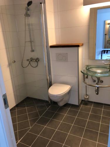 Koupelna v ubytování Husnes Sentrum Hotell