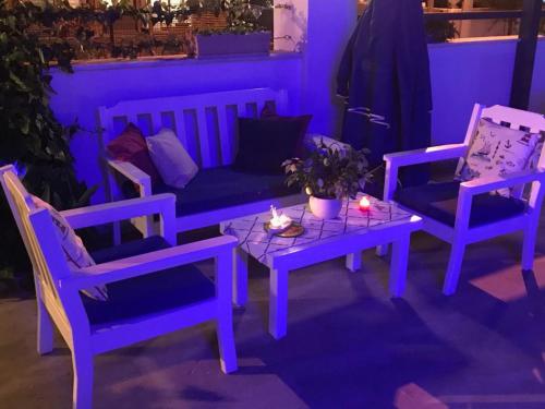 a living room with two chairs and a couch and a table at Rota Hotel in Dalyan