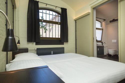 Ein Bett oder Betten in einem Zimmer der Unterkunft Alibi Hostel Leeuwarden