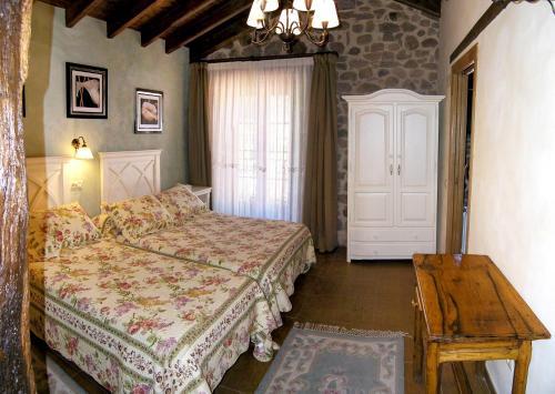 Un pat sau paturi într-o cameră la Casa Paulino