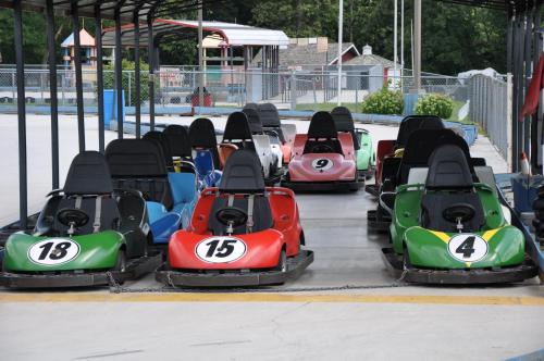 a row of race cars in a amusement park at Aspire Hotel and Suites in Gettysburg
