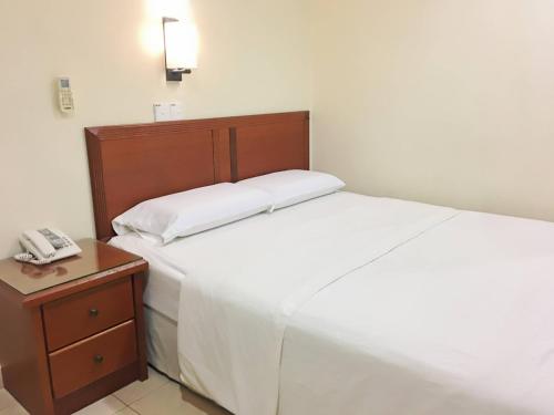 Harbour View Hotel Sekinchanにあるベッド