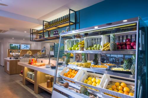a grocery store filled with lots of fruits and vegetables at Infinity Blue Boutique Hotel & Spa - Adults Only in Hersonissos
