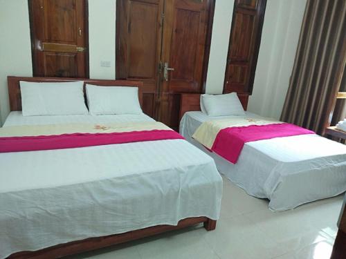 Ліжко або ліжка в номері Anh Khiem Hotel