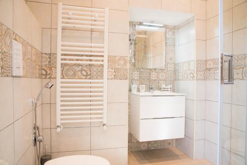 a bathroom with a toilet and a sink at B&B Lumiere Roma in Rome