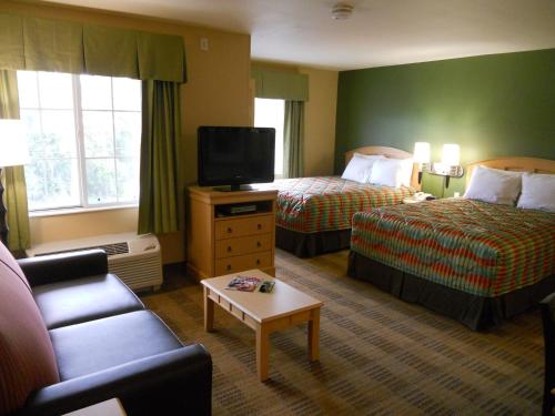 Ένα ή περισσότερα κρεβάτια σε δωμάτιο στο Extended Stay America Suites - Orlando - Convention Center - Universal Blvd