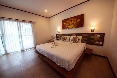 Cama ou camas em um quarto em Vivi Bungalows Resort