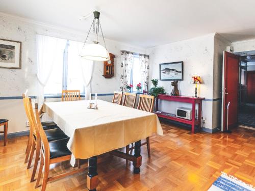 a kitchen and dining room with a table and chairs at Wångens Wärdshus in Alsen