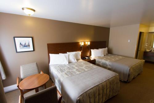 Postel nebo postele na pokoji v ubytování Motel Invitation