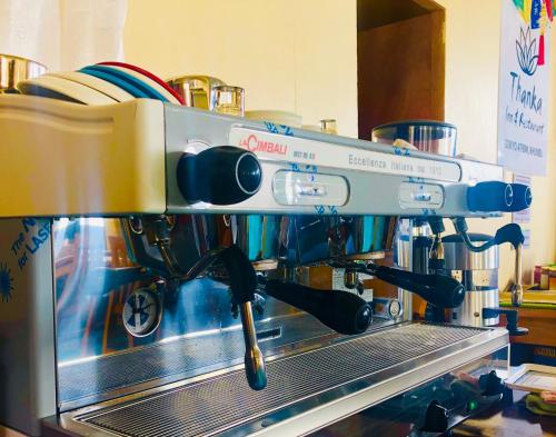 a coffee machine sitting on top of a counter at Gokyo Thanka Inn in Khumjung