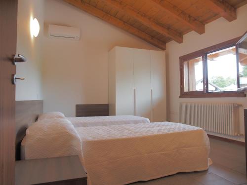 Postel nebo postele na pokoji v ubytování Alloggio Agrituristico Ai Tre Castelli