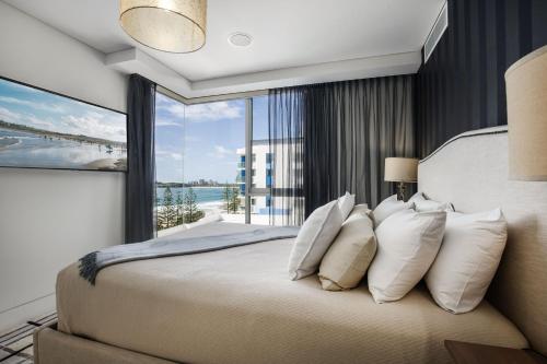 Кровать или кровати в номере Sea Pearl A1 Beach Resort