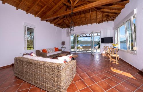 a living room with a couch and a table at Villa Pirgadikia in Pyrgadikia