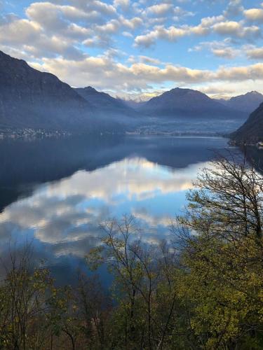a view of a lake with clouds in the water at Milly Lake in Claino