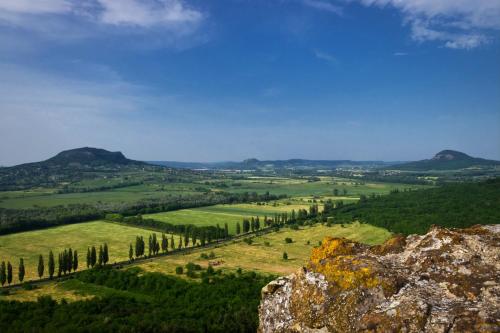 a view of a valley with trees and mountains at ZÁMOR HOLIDAY HOUSE in Keszthely