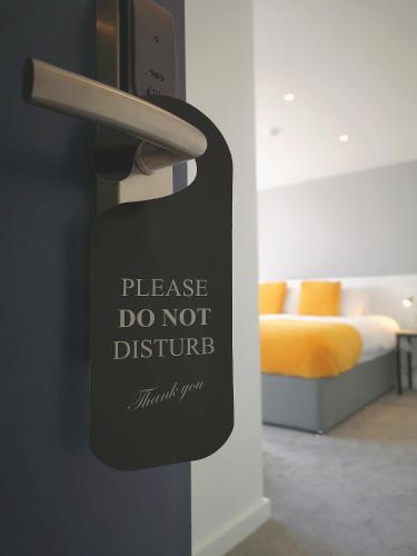 Ein Bett oder Betten in einem Zimmer der Unterkunft Mode Hotel Lytham