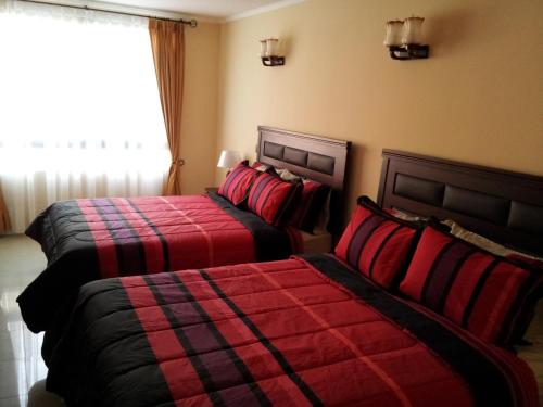 Postel nebo postele na pokoji v ubytování Hotel Astore Suites