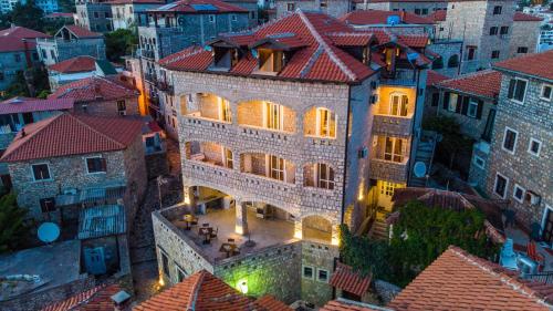an aerial view of a large building with lights at Villa Dulcinea in Ulcinj