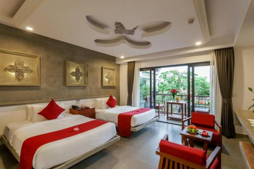 Khmer Mansion Residence tesisinde bir odada yatak veya yataklar