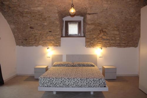 เตียงในห้องที่ Agriturismo Le Anze