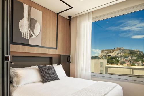 Llit o llits en una habitació de Urban Frame Plaka
