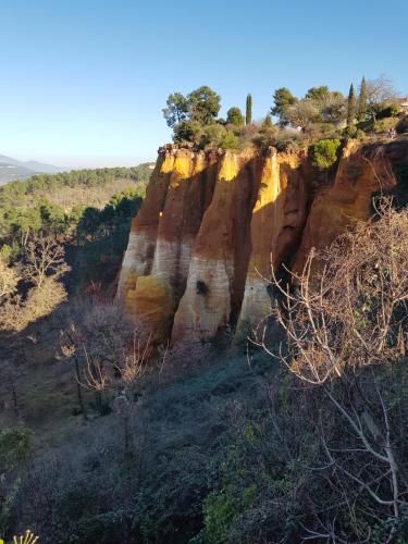 a rock formation with trees on top of it at Le Crillon in Murs