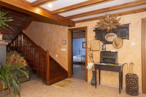 a room with a staircase and aoyer with a stair case at Hotel Rural As Laguas in Tapia de Casariego