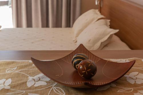 a pair of wedding rings sitting on top of a table at Apart Hotel Rivadavia 815 in Neuquén
