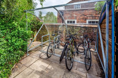 two bikes are parked in a greenhouse at Astor York Hostel in York