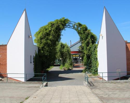 an entrance to a building with an arch at Motel Vega in Sezimovo Ústí