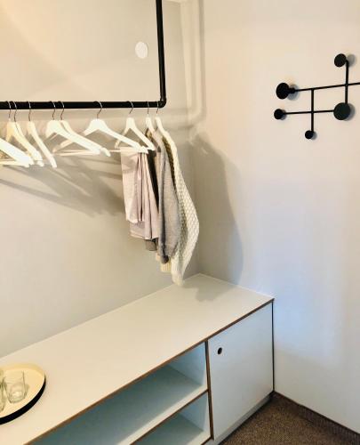 a room with a white table and a shelf at Hotel Sonnenhof - bed & breakfast & appartements in Innsbruck