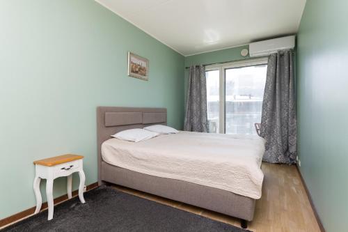 Postel nebo postele na pokoji v ubytování Foorum City Centre Apartment