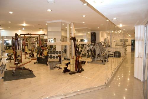a gym with many different equipment in a room at Phoenicia Grand Hotel in Bucharest