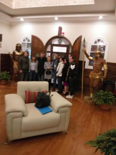 a group of people standing in a room with a couch at Hotel Boutique Spa Villa de Sant in Quito