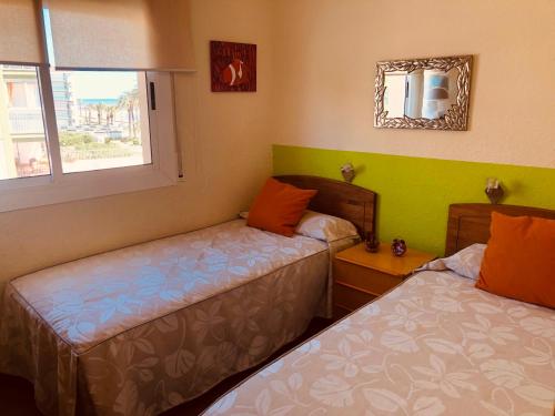 Llit o llits en una habitació de Cunit Playa 2