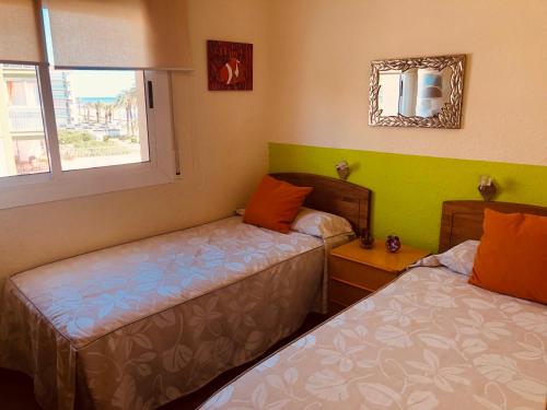Postel nebo postele na pokoji v ubytování Cunit Playa 2