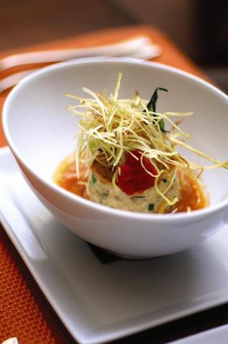 a bowl of food on a plate on a table at Casa de Sierra Nevada, A Belmond Hotel, San Miguel de Allende in San Miguel de Allende
