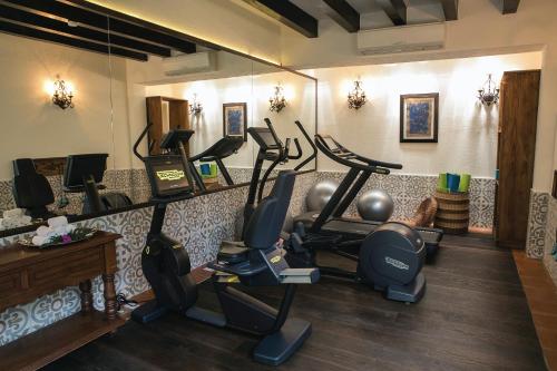 a fitness room with cardio equipment on the wall at Casa de Sierra Nevada, A Belmond Hotel, San Miguel de Allende in San Miguel de Allende