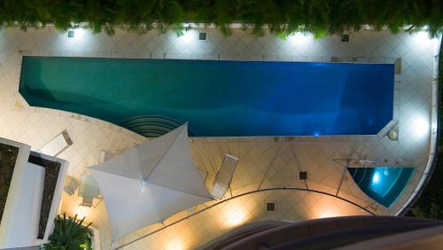 a large swimming pool in a building with a pool at Cilento Mooloolaba in Mooloolaba