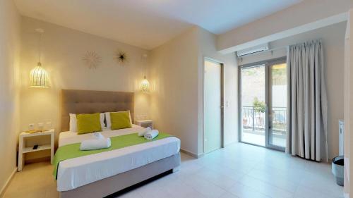Ένα ή περισσότερα κρεβάτια σε δωμάτιο στο Kiperi Exclusive