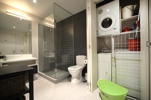 a bathroom with a toilet and a shower and a sink at QV 2 Bedrooms Apartment Overlooking Marina -680 in Auckland