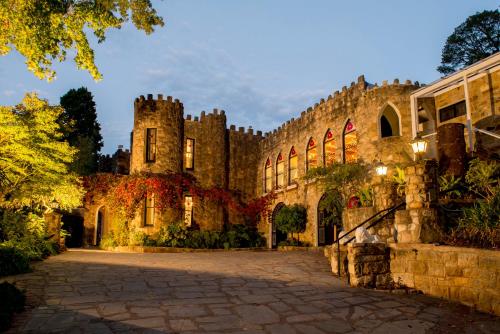 an old castle with a cobblestone street in front of it at The Manor Basket Range in Basket Range
